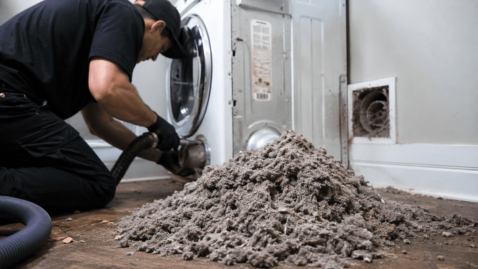 Lint buildup removed during dryer vent cleaning